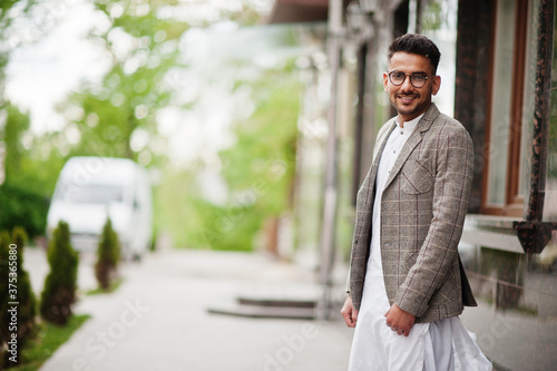 Stylish pakistani man wear in eyeglasses and jacket.