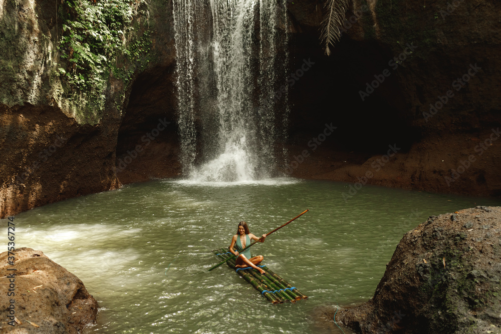 Woman travell to the waterfalls in jungles on Bali island, Indonesia ...