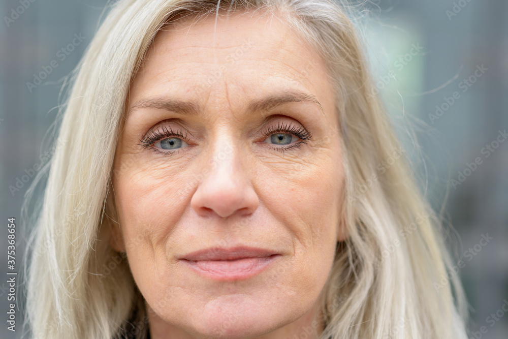 Close up cropped portrait of a mature woman