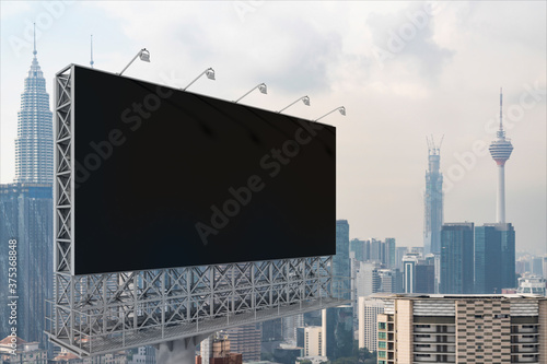 Photography Blank black road billboard with Kuala Lumpur cityscape background at day time