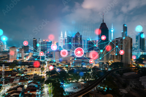 Photography Abstract technology icons, night aerial panoramic cityscape of Kuala Lumpur, Malaysia, Asia