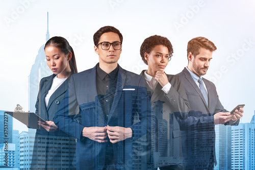 Photography Group of four business colleagues in suits working and dreaming about new career opportunities after MBA graduation
