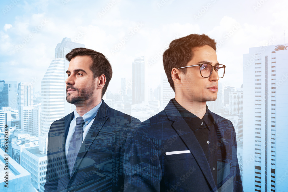Two young handsome businessman in suits dreaming about new career opportunities after MBA graduation. Teamwork concept. Bangkok on background. Double exposure. Two young handsome businessman in suits dreaming about new career opportunities after MBA graduation. Teamwork concept. Bangkok on background. Double exposure.