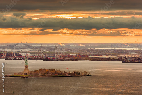 New York Harbor, New York, USA with the statue of liberty and Bayonne, New Jersey in the background. photo