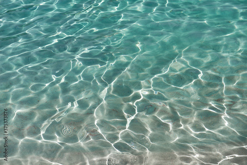 Sun reflections on the crystal clear sea water