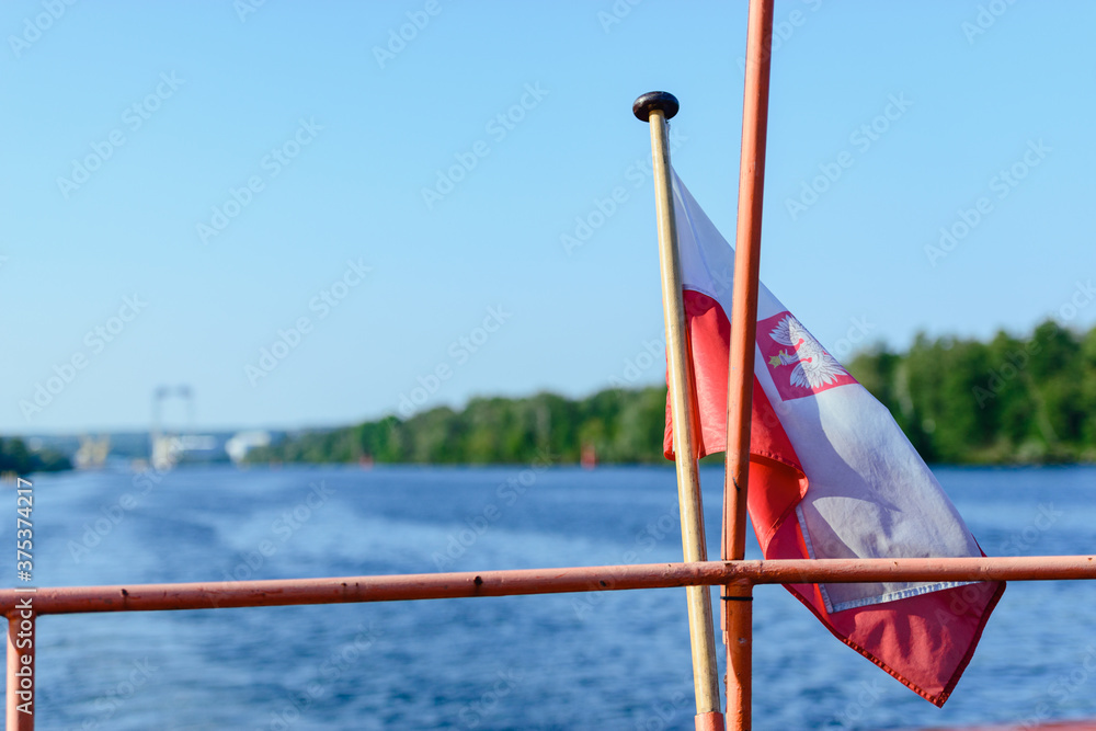 Flag of Poland at the sail ship. Odra river Flag of Poland at the sail ship. Odra river