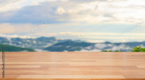 A beautiful empty wood board with white blur people in bright indoor cafe background .For montage product display or design key visual layout background..