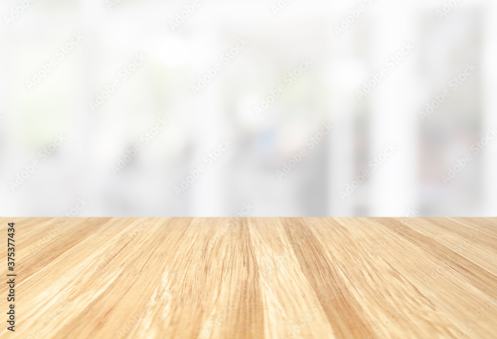 beautiful empty wood table with blur modern white kitchen and coffee cafe with window background, interior clean tone . Ready for product display  montage. - obrazy, fototapety, plakaty 