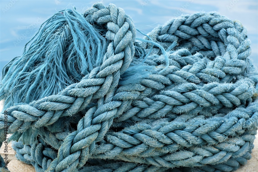 Blue rope for the boat by the sea background