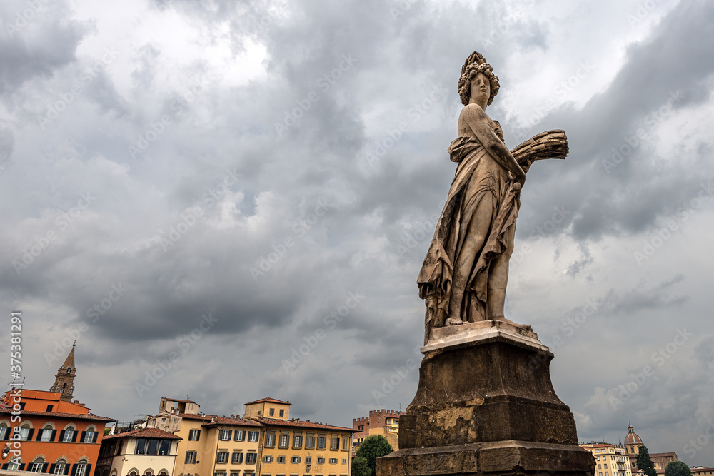 Florence, marble statue, symbol of summer, on the Ponte Santa Trinita (Ancient bridge, XVI century), sculptor Giovanni Battista Caccini (1556-1613). Tuscany, Italy, Europe