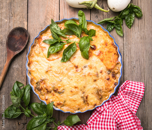 Musaka close-up side view. Traditional Greek dish of baked layers, eggplant, meat, Bechamel sauce photo