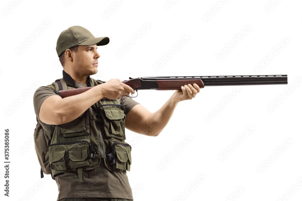 Fototapeta premium Man standing and aiming with a shotgun
