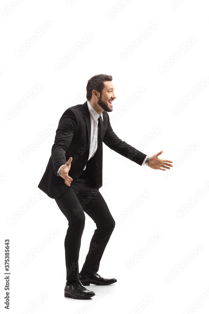 Happy young man in a suit gesturing with hands Happy young man in a suit gesturing with hands