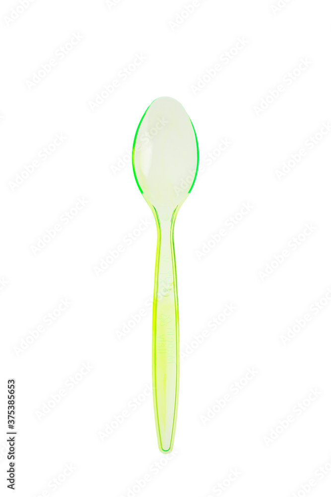 Cucchiaio da yogurt verde bicolore e trasparente fotografato su sfondo bianco Cucchiaio da yogurt verde bicolore e trasparente fotografato su sfondo bianco