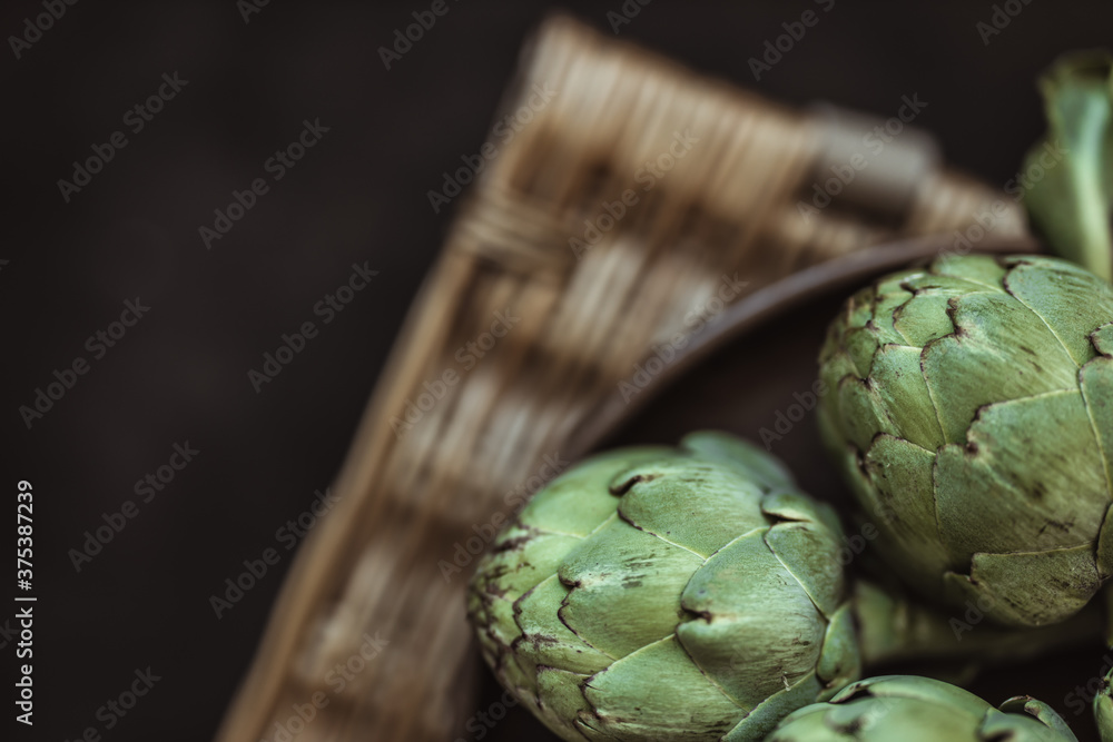 Obraz premium Fresh green artichokes. Top view. Copy space