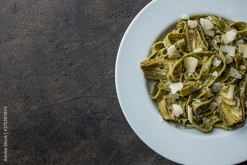 Baby artichokes with pasta. Top view. Copy space Baby artichokes with pasta. Top view. Copy space