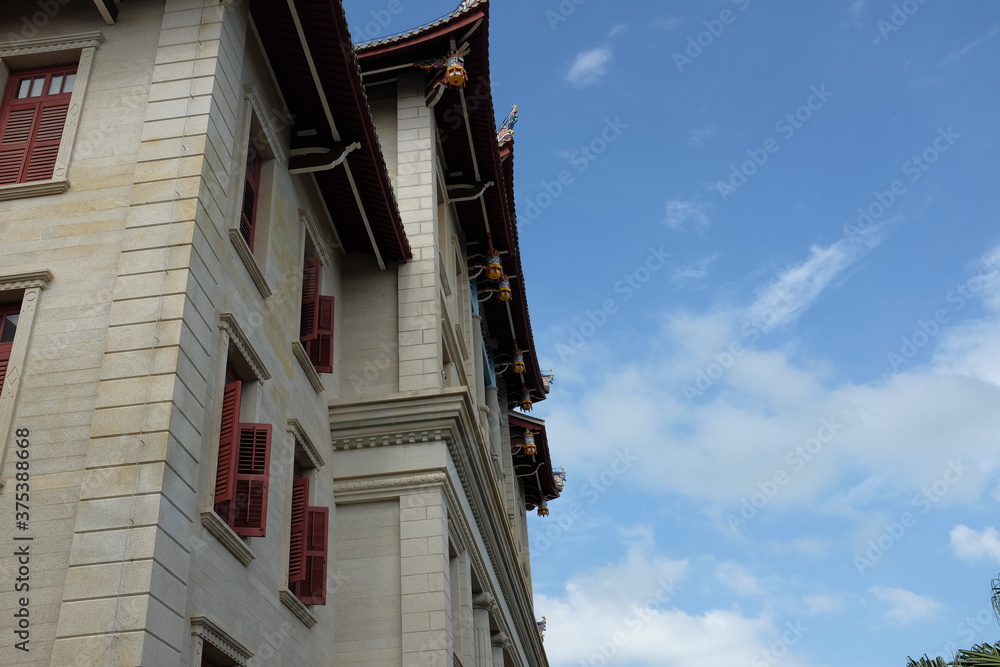 Ancient buildings of Xiamen University in Fujian University under blue sky.