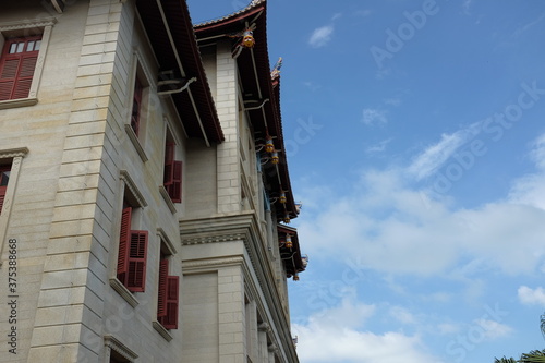 Ancient buildings of Xiamen University in Fujian University under blue sky.