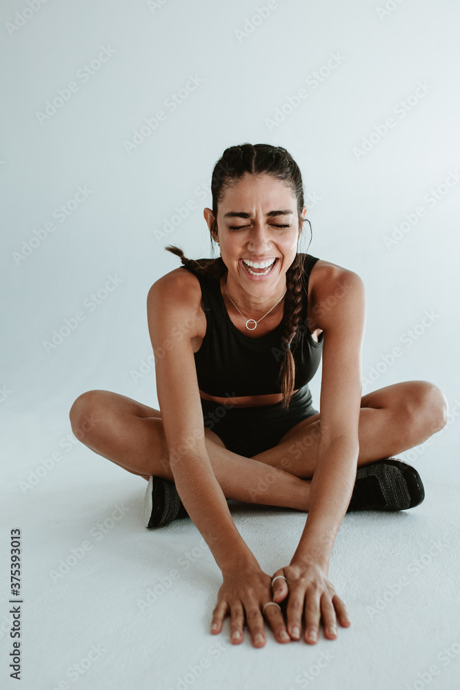 Healthy female relaxing after exercising session Healthy female relaxing after exercising session