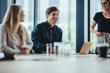 Business people smiling after a productive meeting