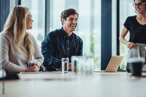 Business people smiling after a productive meeting