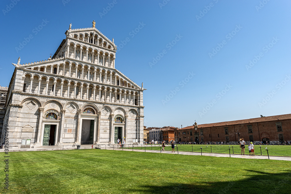 Main facade of the Pisa Cathedral (Duomo di Santa Maria Assunta) in Pisan Romanesque style. Square of Miracles (Piazza dei Miracoli). Tuscany, Italy, Europe