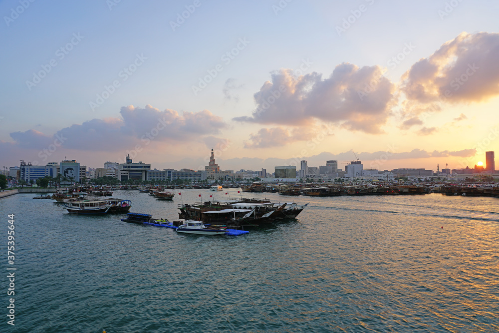 Fototapeta premium Sunset view of the bay and the old skyline in Doha, Qatar