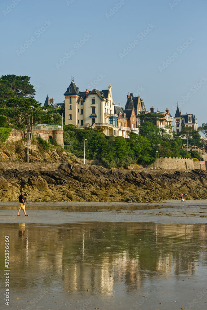 Sand beach and historic villas in Dinard, a popular seaside resort on the french Atlantic ocean coast in Brittany, France.