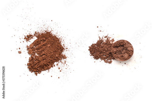 Makeup cosmetics. Eyeshadow in brown color crushed palette, colorful eye shadow powder on white background