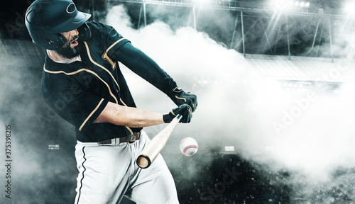 Photography Porfessional baseball player with bat taking a swing on grand arena