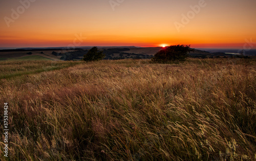 June sunset from Willingdon Hill on the south downs near Eastbourne east Sussex south east England. 