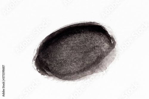 Black color watercolor drawing in round brush or banner shape on white paper background © bankrx