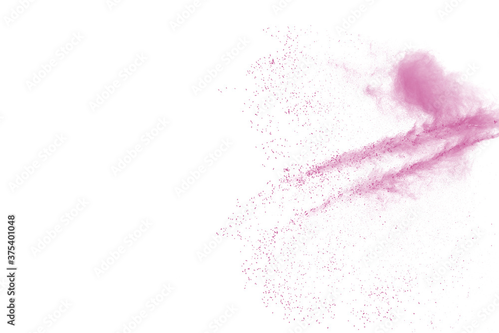 Freeze motion of pink color powder exploding on white background. Freeze motion of pink color powder exploding on white background.