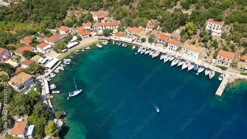 Aerial drone photo of picturesque beautiful seaside village of Kioni a safe anchorage for yachts and sail boats, a true gem of Ithaki or Ithaca island, Ionian, Greece