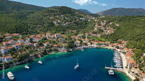 Aerial drone photo of picturesque beautiful seaside village of Kioni a safe anchorage for yachts and sail boats, a true gem of Ithaki or Ithaca island, Ionian, Greece