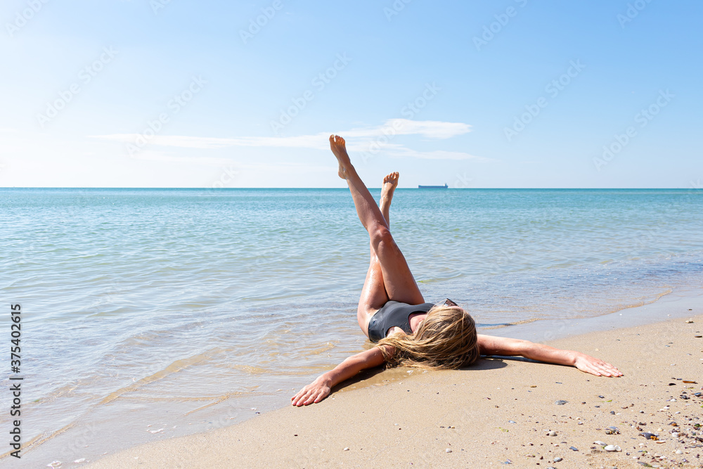 Happy young woman enjoying the sea Happy young woman enjoying the sea