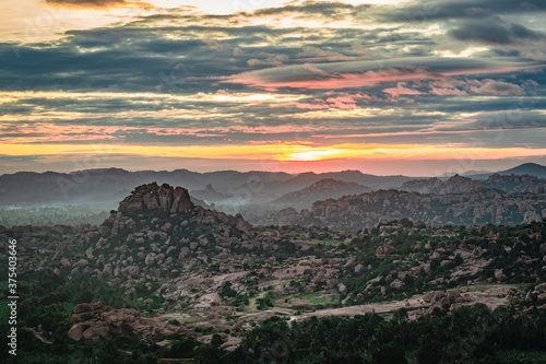 rocky mountain sunrise with dramatic sky at dawn flat angle shot