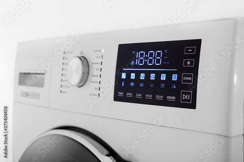 Details of digital display and washing machine volume on white background