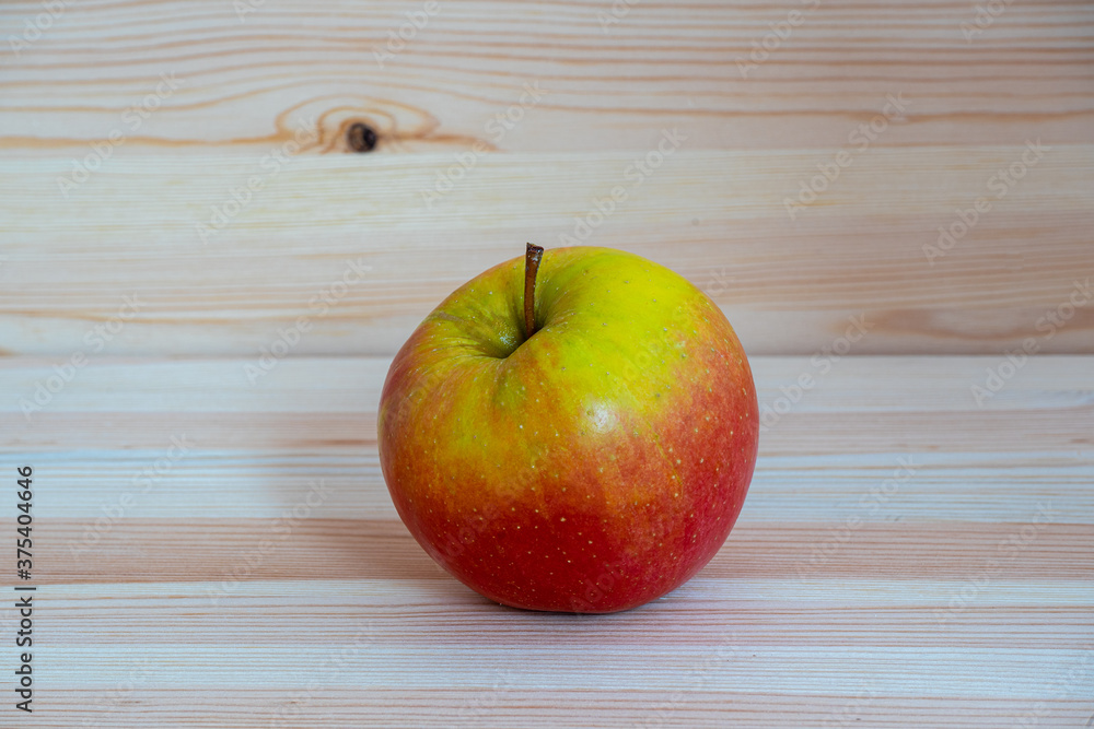 Red fresh apple on wood table Red fresh apple on wood table