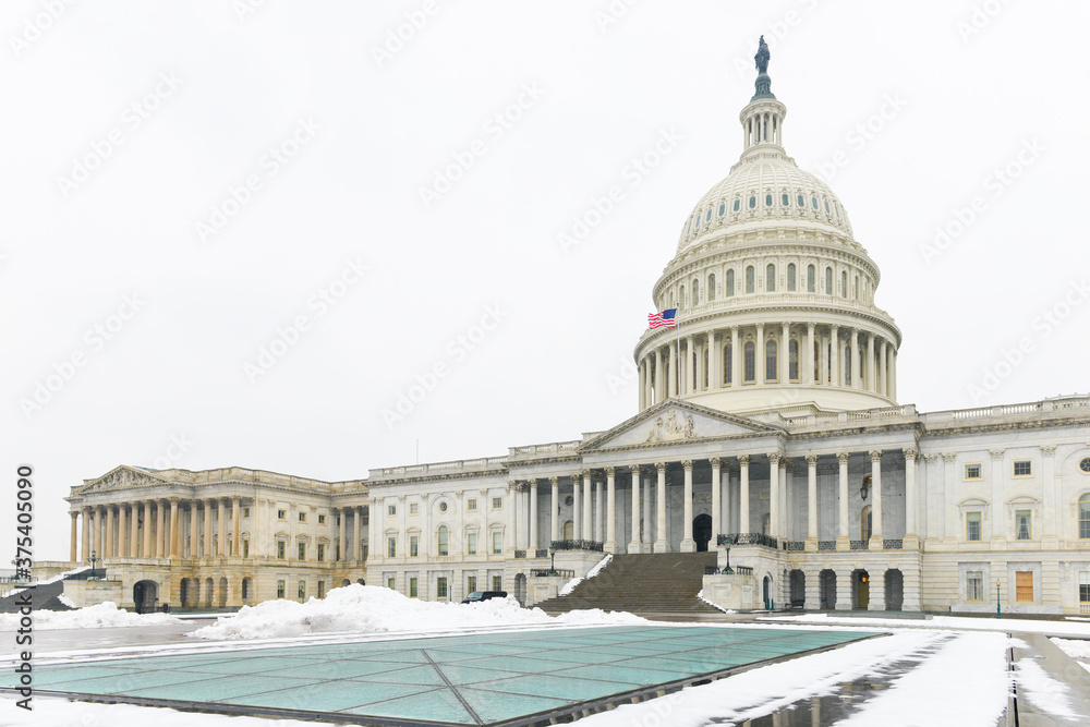 United States Capitol Building in snow - Washington D.C. during wintertime - Washington D.C. United States of America