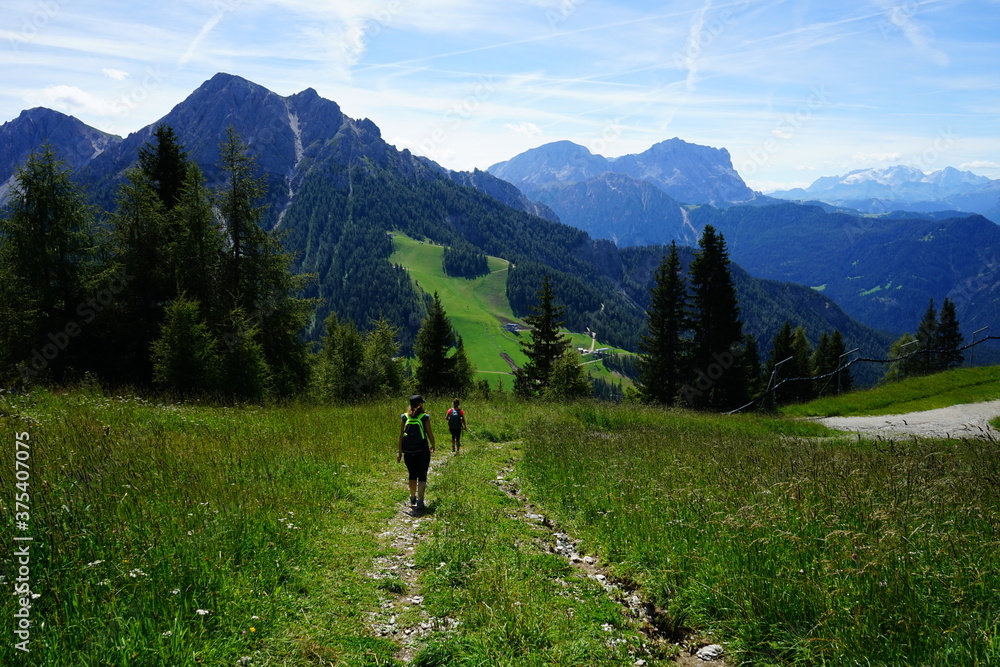 Hikers girls walking on Plan de Corones, Sudtirol, Trentino Alto Adige, Dolomites, Unesco, Italy