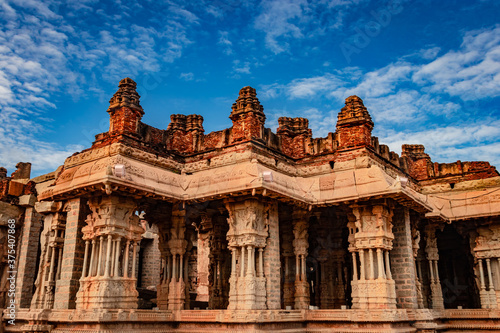 vithala temple hampi ruins antique stone art from unique angle with amazing blue sky © explorewithinfo