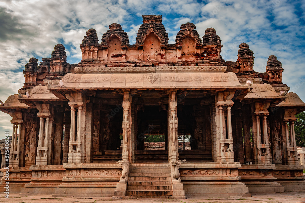 vithala temple hampi ruins antique stone art from unique angle with amazing blue sky