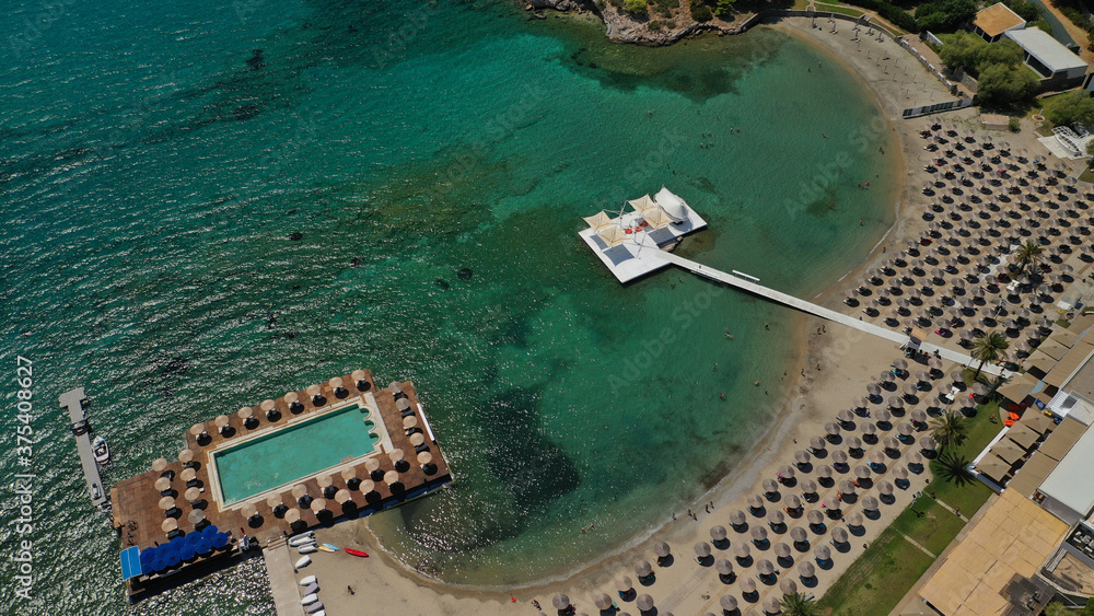 defaultAerial panoramic view of famous Grand Resort Lagonisi or Lagonissi paradise peninsula and beach with pool facilities in exotic peninsula, Athens riviera, Attica, Greece