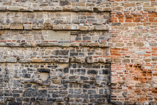 Fragment of an old wall with brickwork of different bricks on the 16th century Medici Chapel (Capelle Medicee) in Florence, Italy