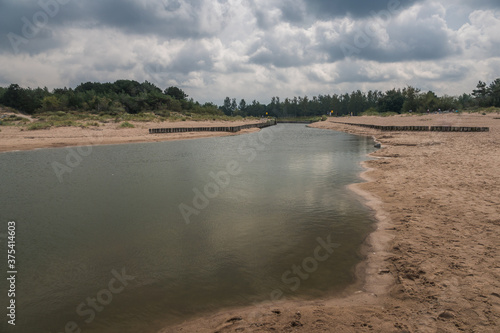 Obraz na płótnie Jamienski Nurt water channel connecting the Baltic Sea with Lake Jamno near Mielno, Zachodniopomorskie, Poland w salonie