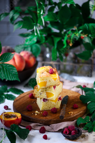 Peach raspberry olive oil cake. rustic photo