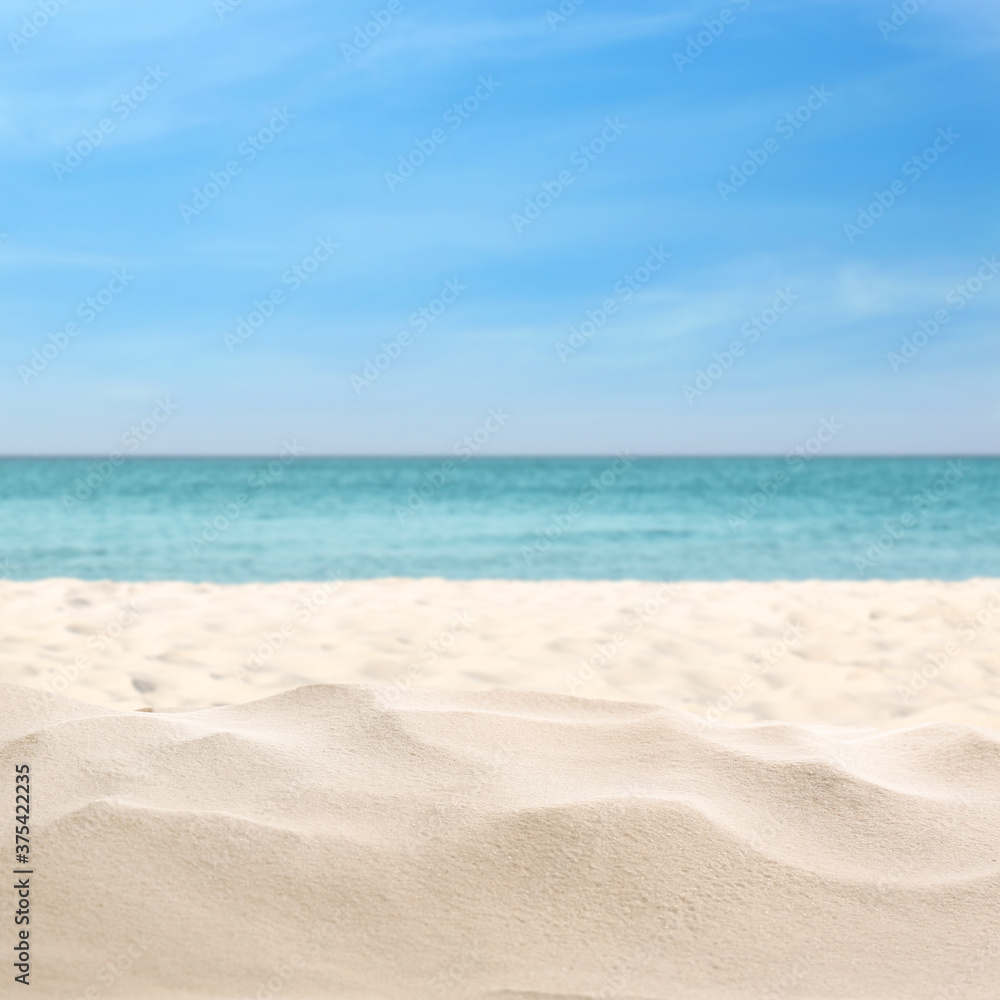 Beautiful beach with white sand near ocean, closeup view Beautiful beach with white sand near ocean, closeup view