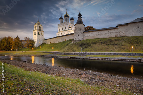 The banks of the Pskova river and the Pskov Kremlin. Trinity cathedral, Pskov, Russia photo