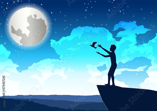 man let bird out to peace on the cliff in beautiful night